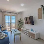 Seaside Apartment With Spacious Terrace, Pool, And Wi-Fi