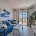 Seaside Apartment With Spacious Terrace, Pool, And Wi-Fi