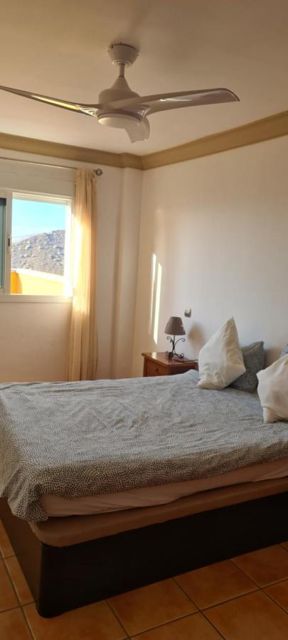 Apartment With A Serene Ocean And Mountain View