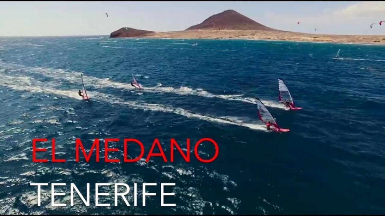 With A Serene Ocean And Mountain View
